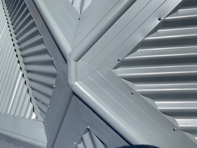 Hip and ridge detail on a new metal roof